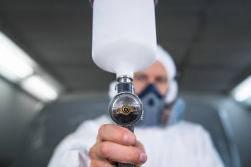 Worker applying coating
